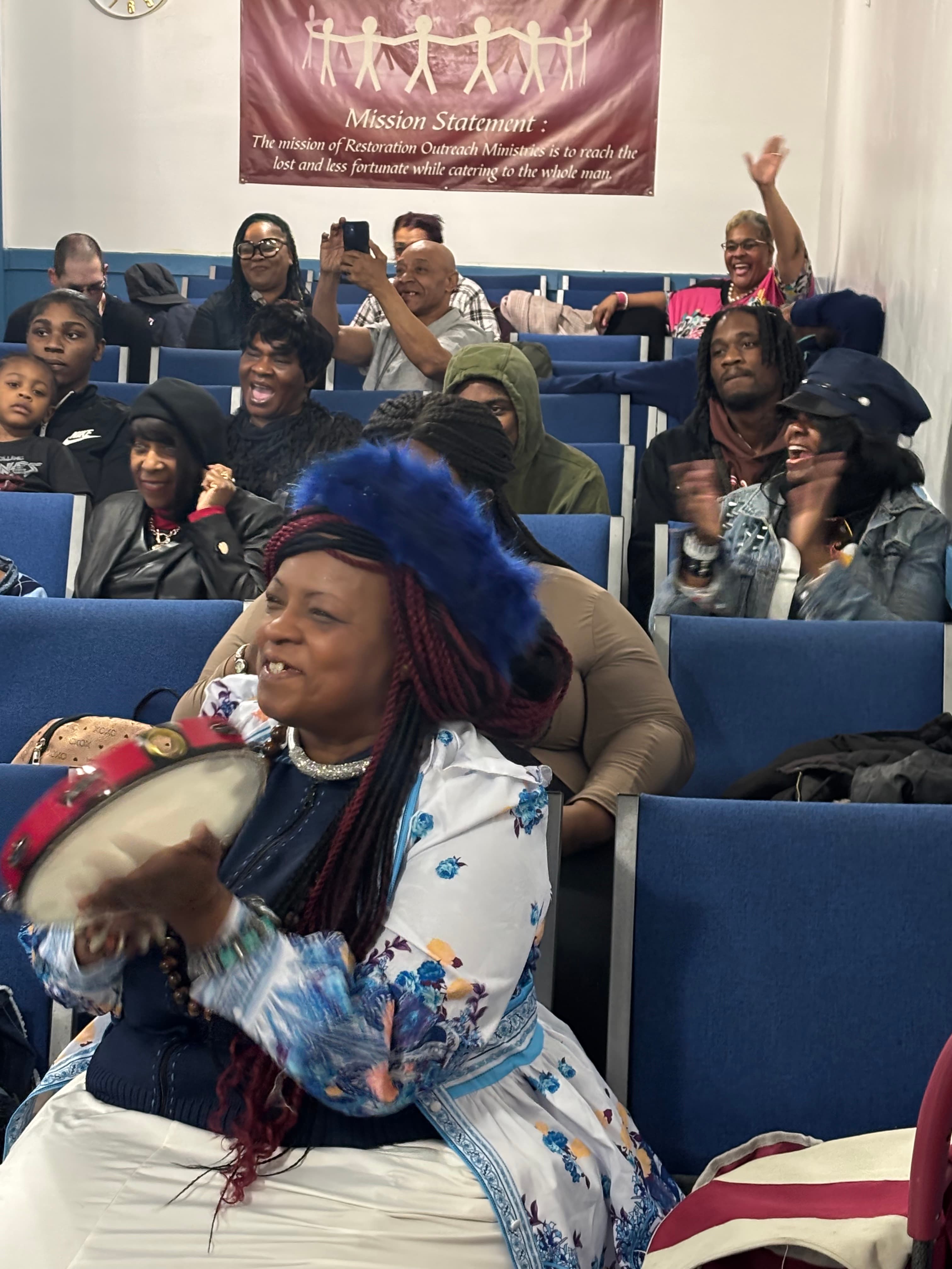 Restoration Outreach Ministries congregation in praise